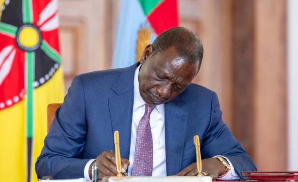 president ruto signs a documents in his office